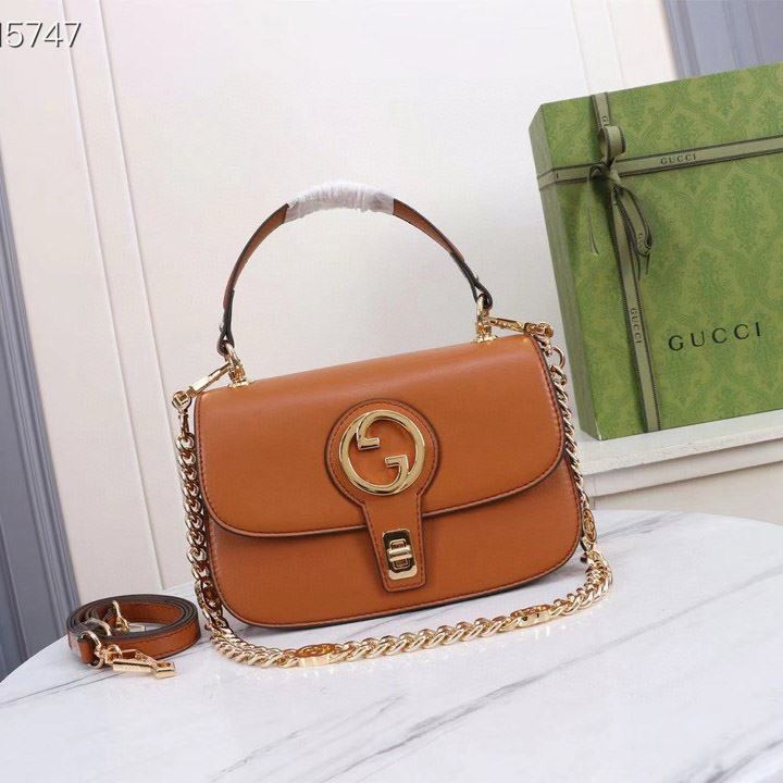 G*u*i top handle bags